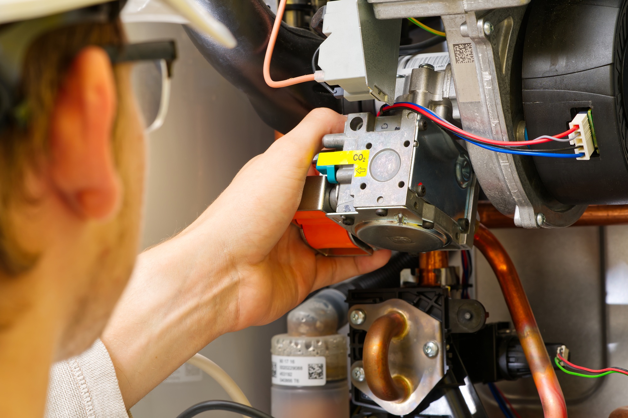 http://Technician%20servicing%20or%20Repair%20of%20a%20gas%20boiler,%20setting%20up%20and%20servicing.%20gas%20boiler%20for%20heating